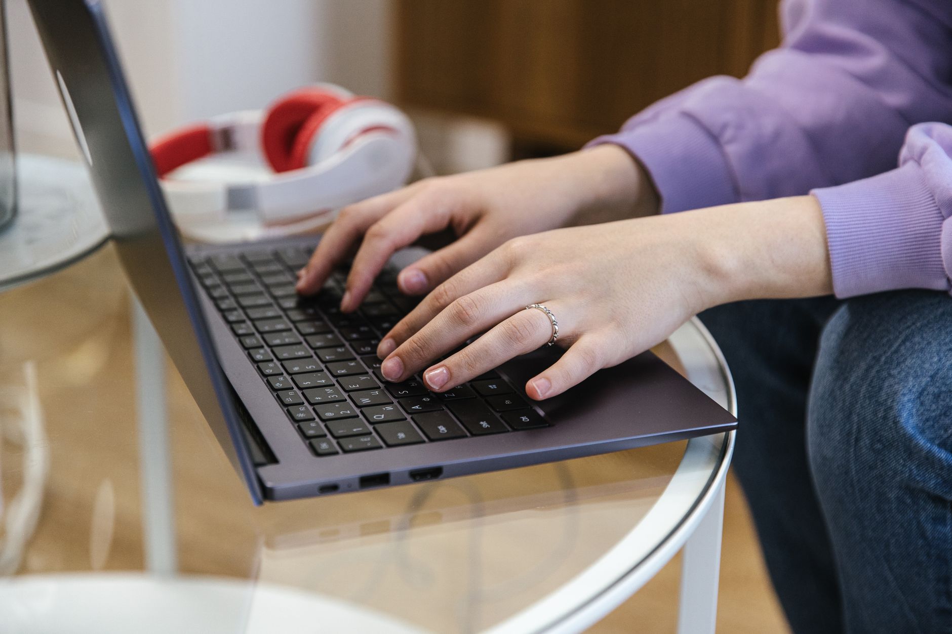 Writing an email at a laptop